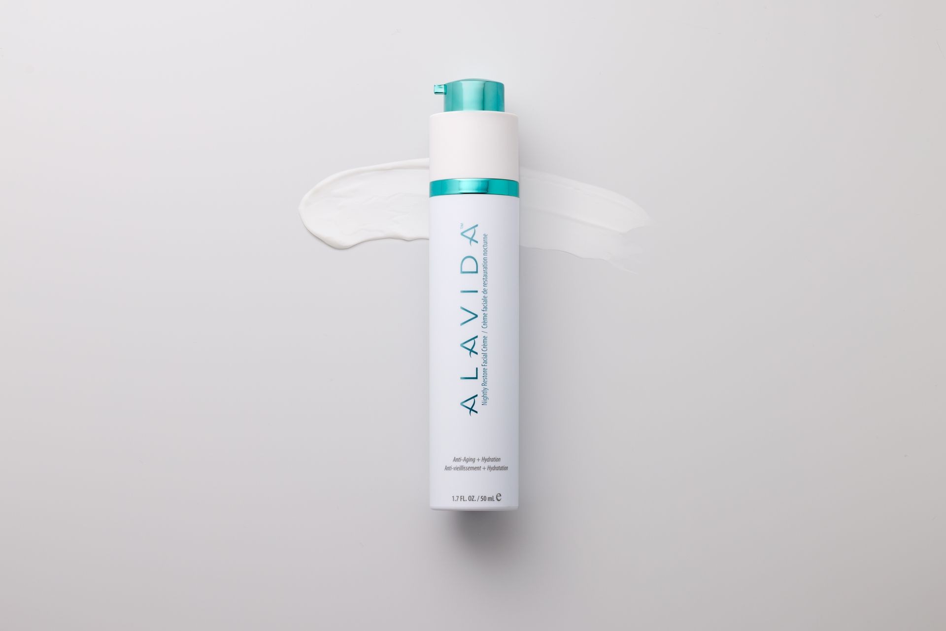 ALAVIDA anti-aging and hydration facial cream bottle on a white background with cream smear.